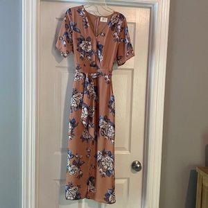 Fully lined dress size small with pockets and belt in the  front